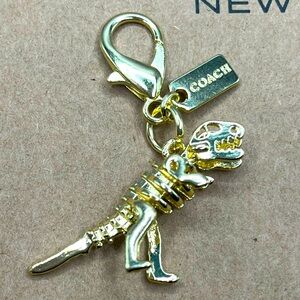 Coach Gold Dinosaur Bag Charm